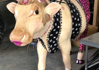 fiberglass cow in the workshop being restored